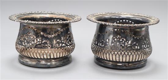 A pair of silver-plated coasters with deep pierced borders H.11cm, 17cm diameter